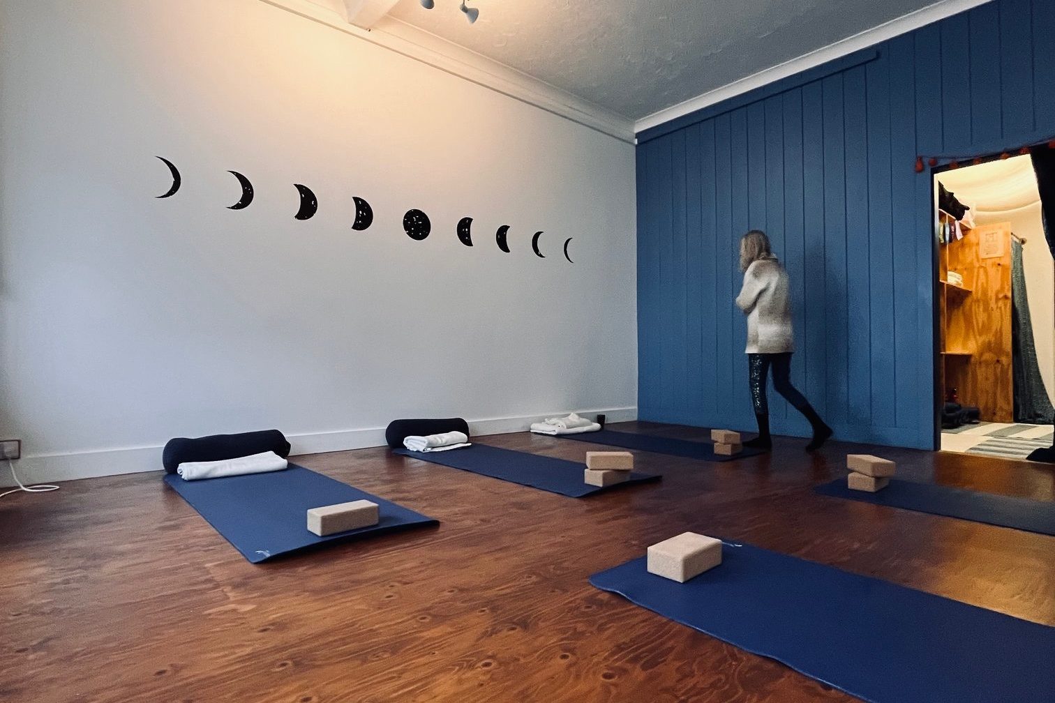Yoga studio with moons on wall